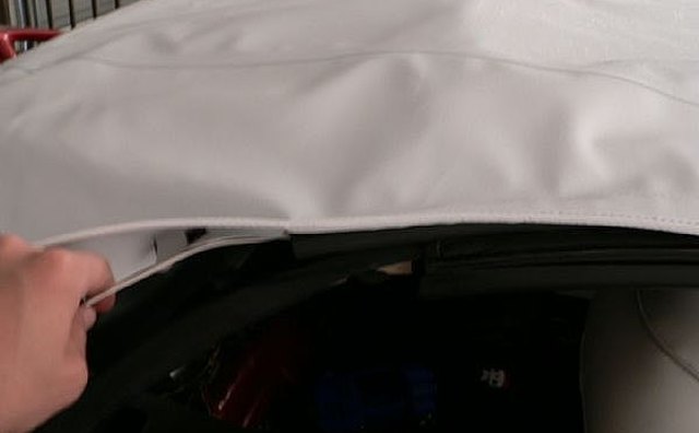 Pulling cord through the side of the top