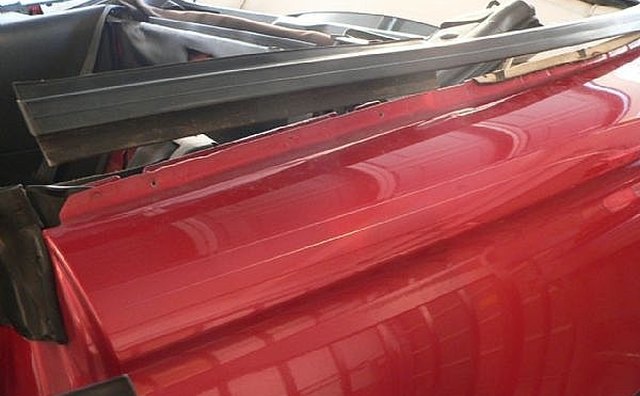 The u-shaped metal strip (shown unscrewed)
