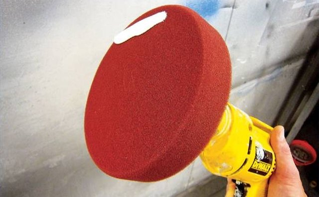 Use a polisher for best results in removing rubbing compound.