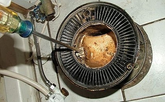 Remove retaining screw from under the flush ball.