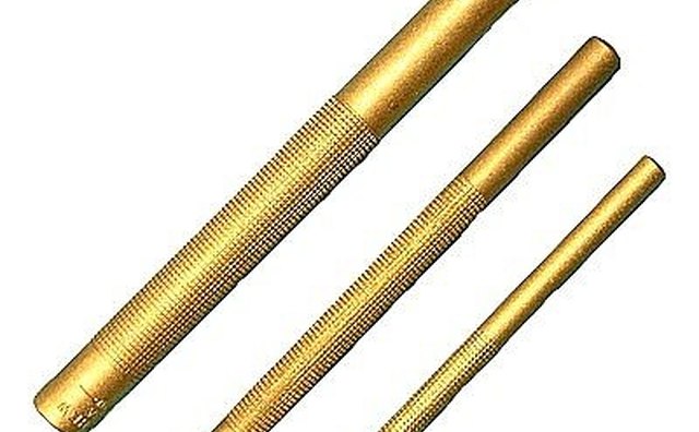 Use a brass punch to remove old upper seal.
