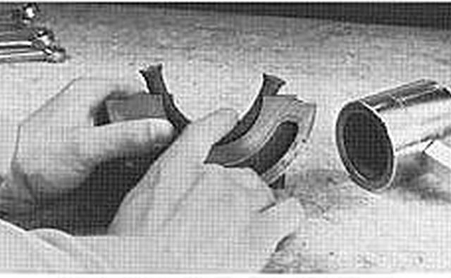 Press the new seal into the rear main bearing cap.