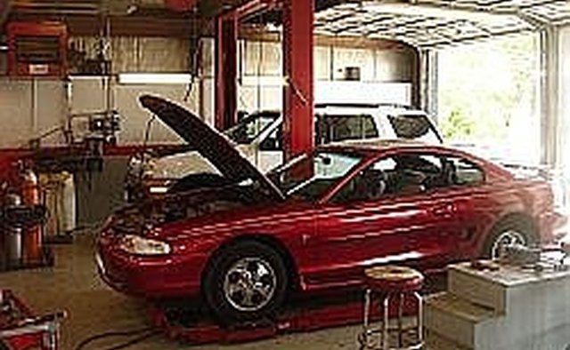This is what you need really a car hoist, mabe not this one, but a car hoist