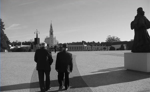 Men walking toward Fatima Cathedral
