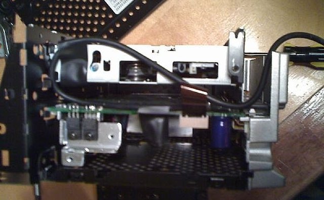 Route the aux inoput cable through the back