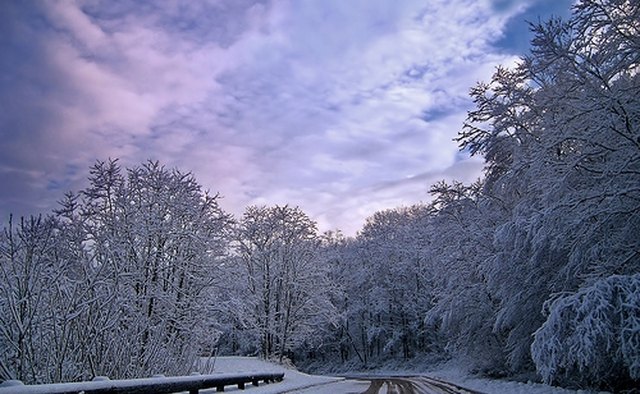 A road covered with light snow