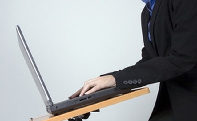 Sit upright with floated wrists when typing.