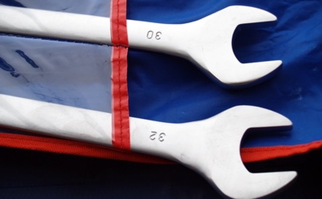 A long, angled-end wrench can be used to loosen the distributor mounting bolt.