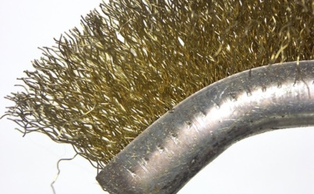 Use a small wire brush to clean the battery connections.