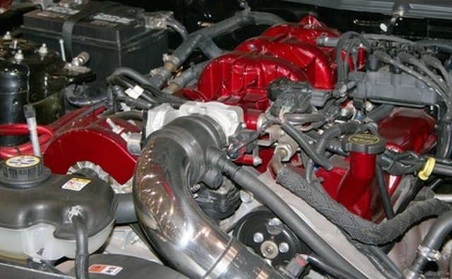 The 428 CJ engine has a smooth block surface above the oil-pan rail.