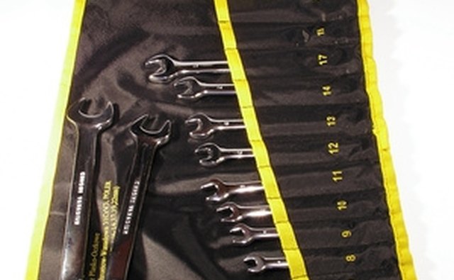 Use a wrench set to remove the battery cable.