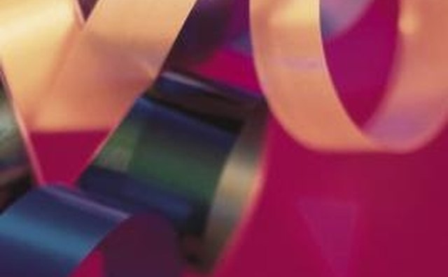 Make a bracelet using colorful ribbon.