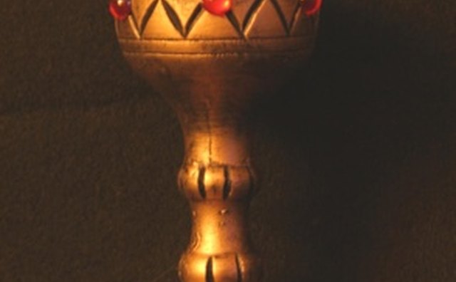 Eucharistic ministers clean chalices. and bowls after Mass.