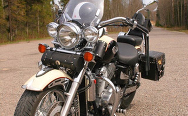 This bike has been decked out for touring with a windshield, custom seat, sissy bar and saddlebags.