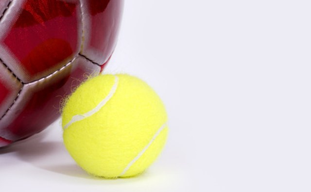 Scottish girls bounced a small ball against the wall.