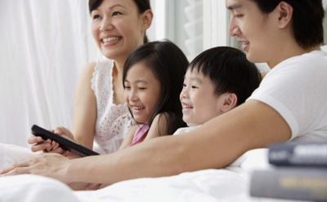 A Chinese family watches a movie on TV