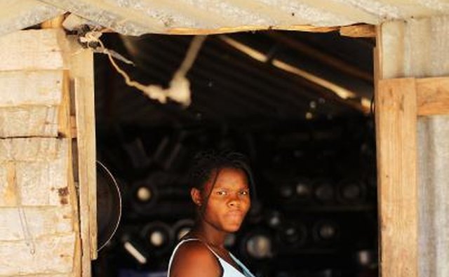 Woman at her home in Tierra Nueva, Dominican Republic