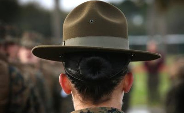 Female Marine Corp Drill Sargent with recruits during boot camp training