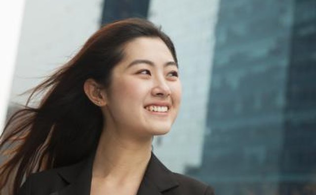 Business woman smiling outside office