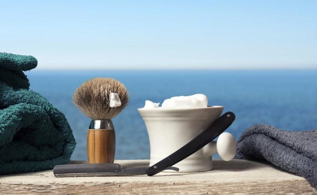 Old fashion shaving kit with brush, razor and cream.