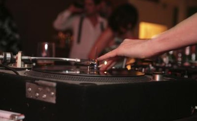 A DJ spinning records at a house party.
