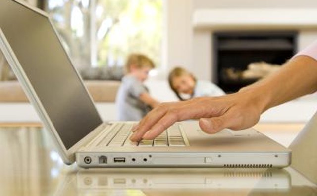 Mother looking at laptop
