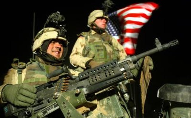 Corporal and PFC of the 101st. Airborne division on top of a humvee
