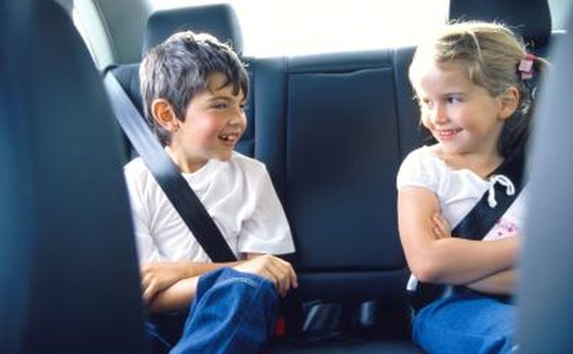 Children riding in back of car