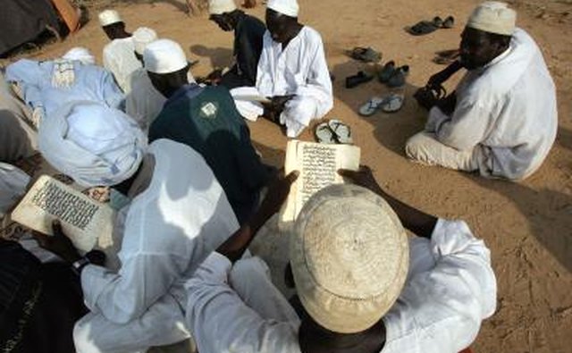 Muslim men from Darfur reading Koran in Sudan mosque