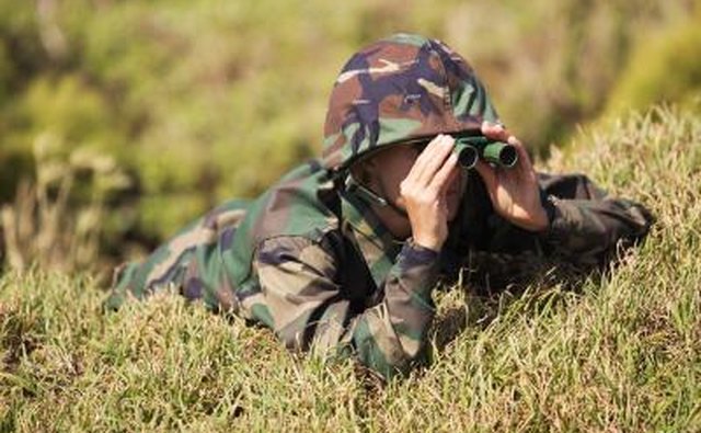 Soldier looking through binoculars