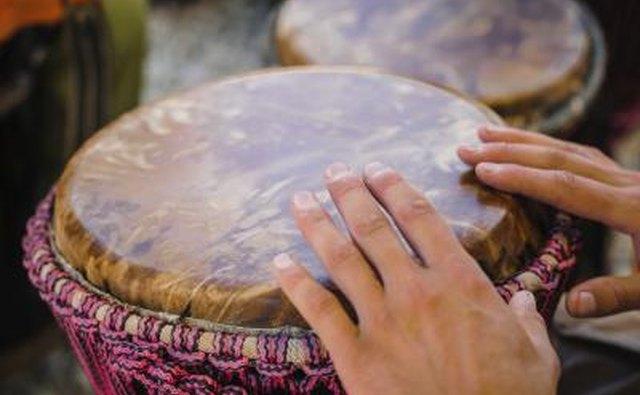 Man playing African drum.