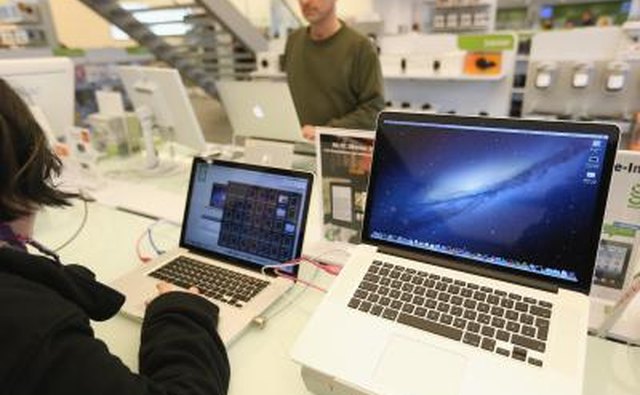 MacBook Pro models on display at Apple Store