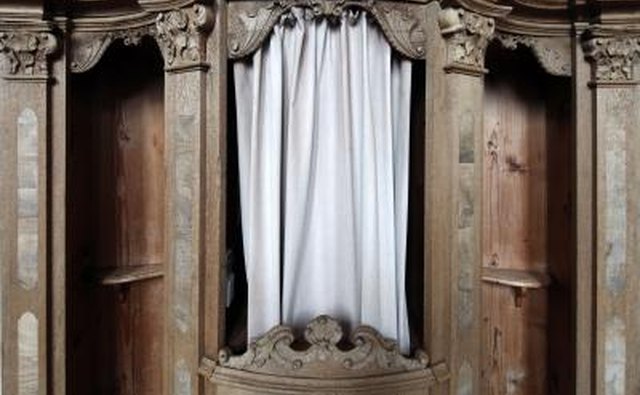 Reconciliation, the Penance sacrament, begins in a Catholic confessional