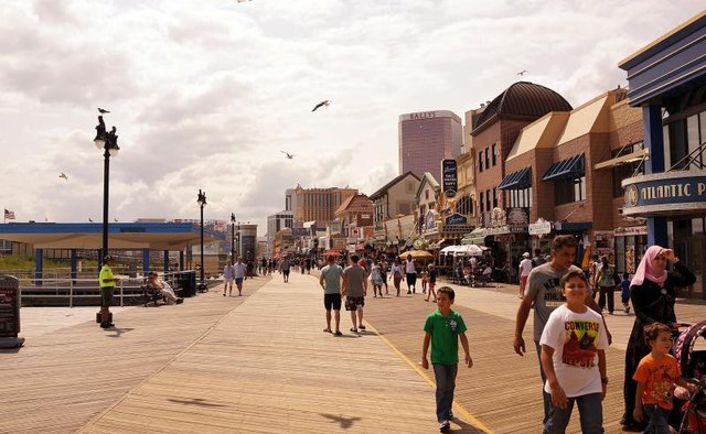 Tourists walk along the boardwalk in Atlantic City, New Jersey.