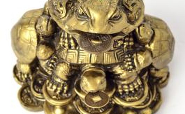 This traditional statue of Ch'an Chu holds a coin within its mouth, perhaps as a way of summoning other coins to follow.