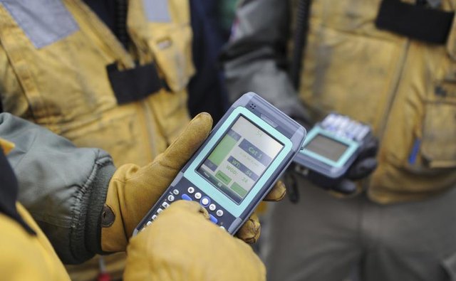 Team of military personal receiving communication