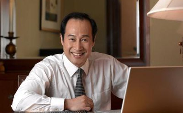 Chinese businessman with laptop.