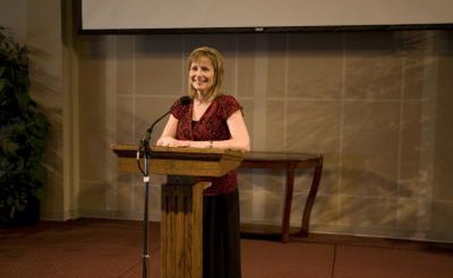 Giving a sermon into a microphone