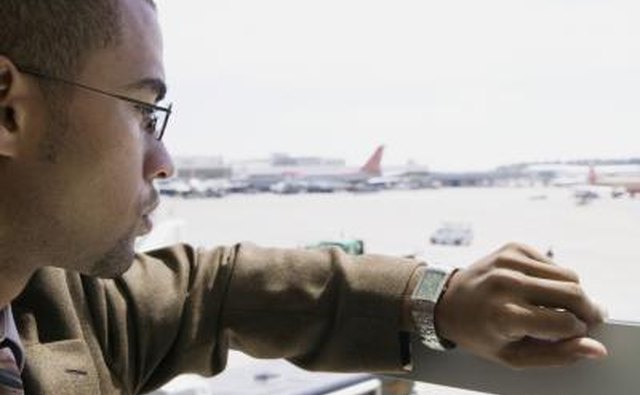Man looking at a watch.
