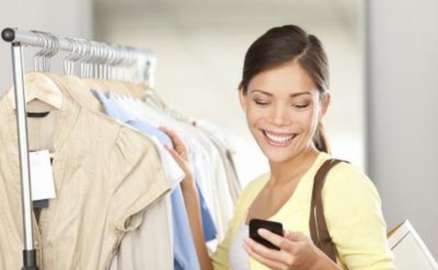 woman smiling while she reads text