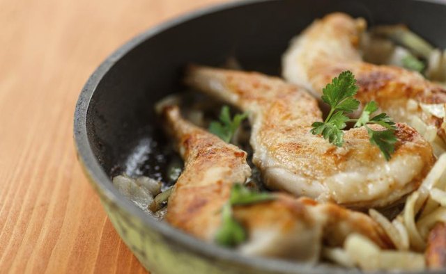 Roasted rabbit in a frying pan.