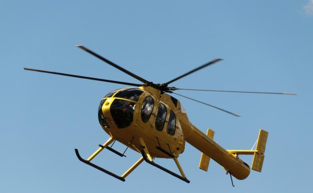 A tourist helicopter in flight.