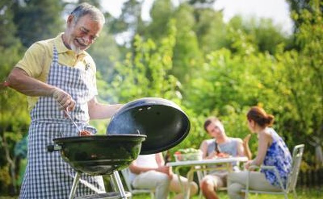 Man barbecuing meat.