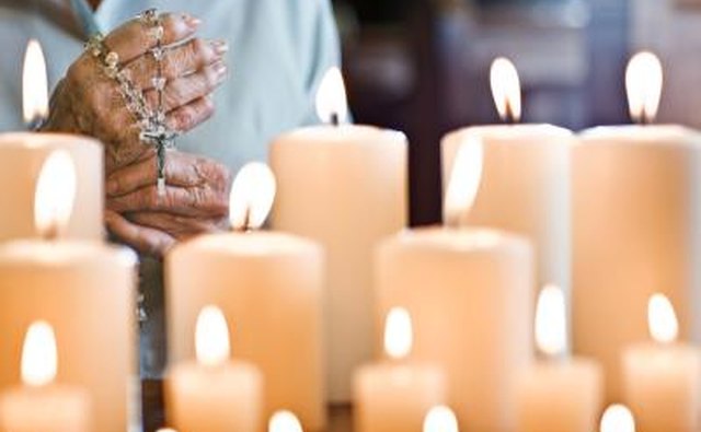 Praying with a rosary.