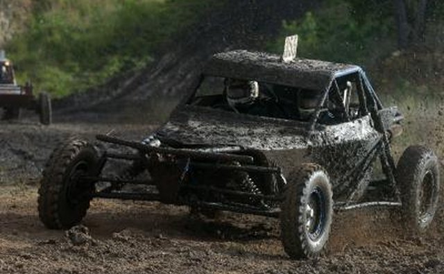 Off-road buggy racing in the mud