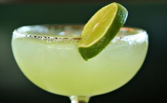 A close-up of a margarita with lime.