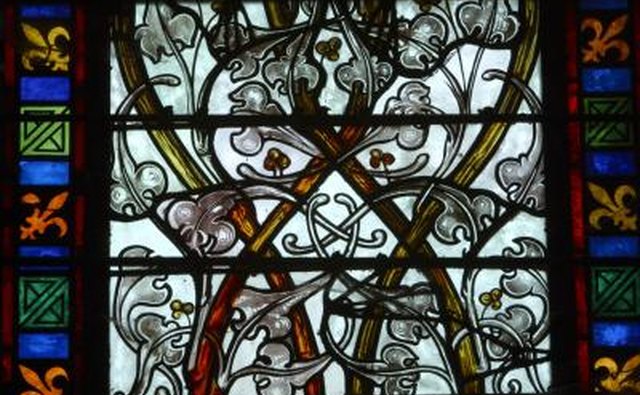 Fleur-de-lis on a stained glass window in France.