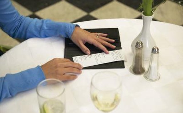 woman paying dinner bill