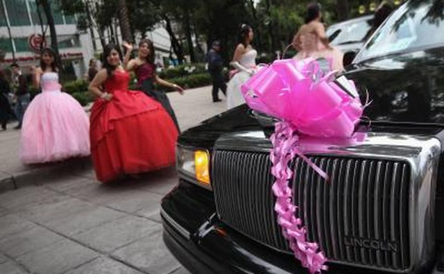Quinceanera girls in Mexico walk to limousine