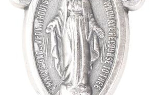 Pendants and statues of religious figures are often left as a sign of respect and love both for the dead and their beliefs.